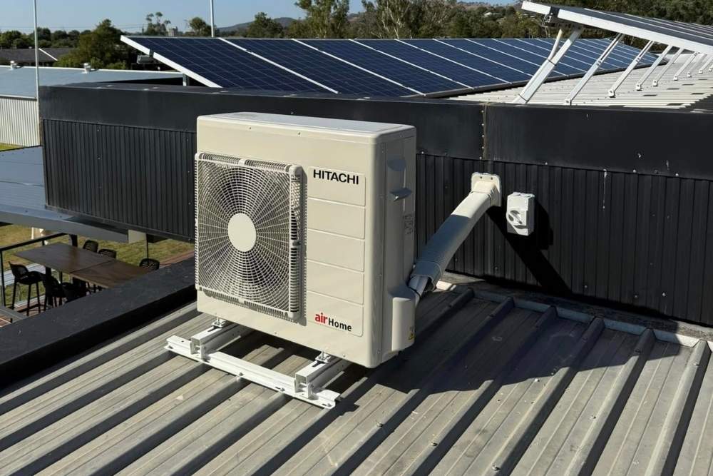 Hitachi air conditioner unit installed on a commercial roof